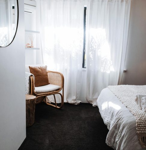 pexels-photo-4993092-4993092 Interior design of stylish bedroom with comfortable bed and chair placed in corner near window